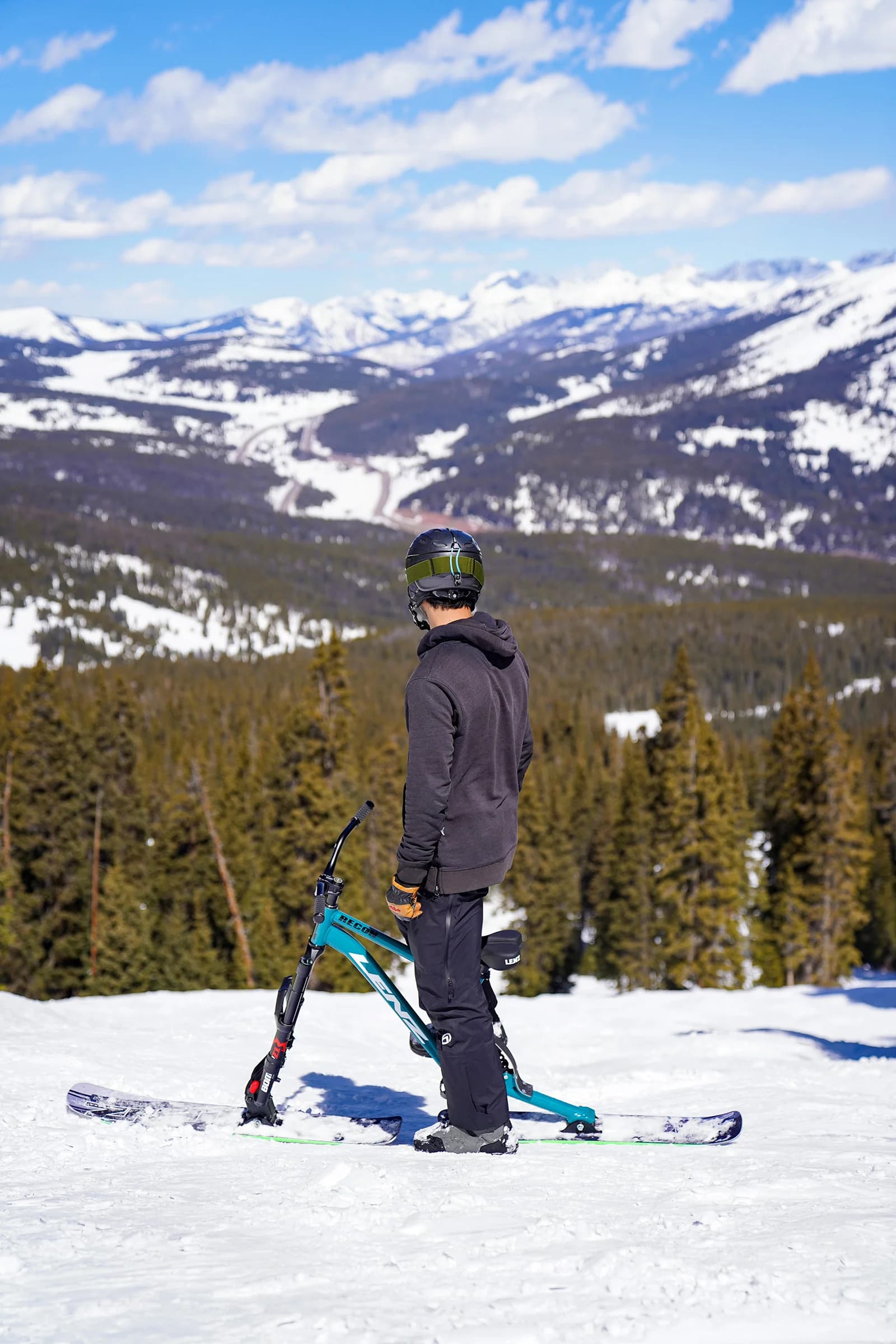 Ski-bike rider launching off a berm during an ASA Racing heat.